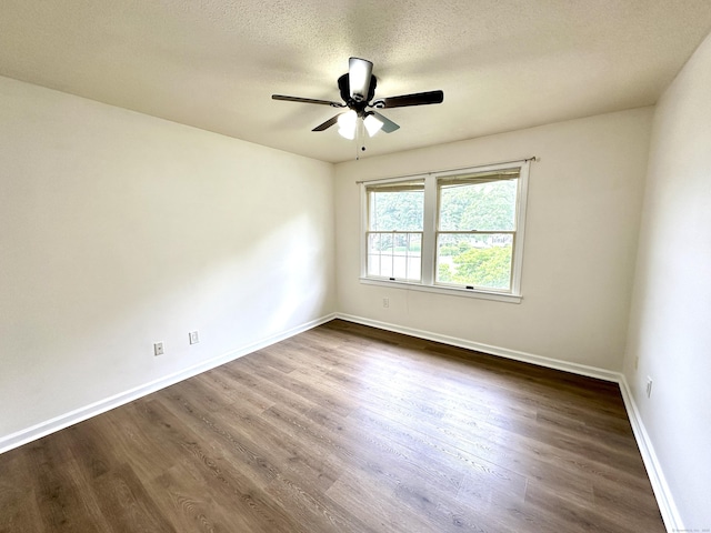 1 Concorde Way Unit B3, Windsor Locks, CT 06096 - spare room featuring dark wood-type flooring, ceiling fan, baseboards, and a textured ceiling