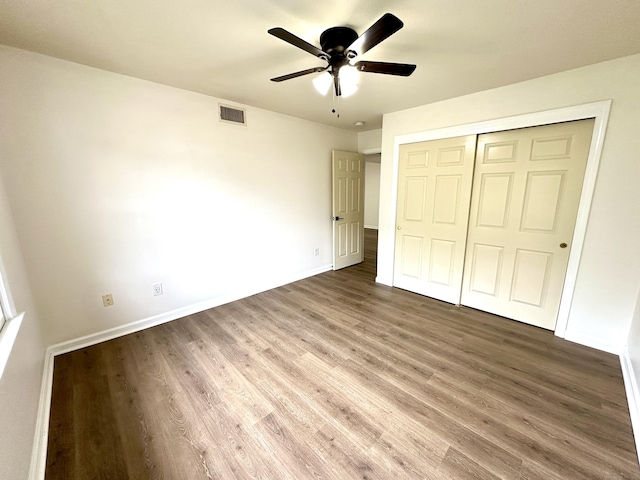 1 Concorde Way Unit B3, Windsor Locks, CT 06096 - unfurnished bedroom featuring wood finished floors, baseboards, and a closet