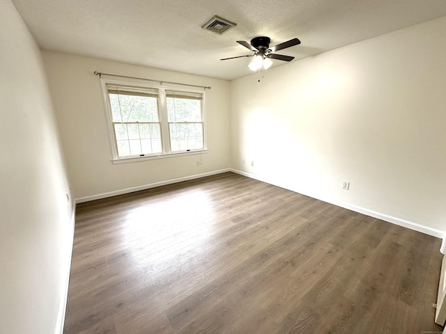 1 Concorde Way Unit B3, Windsor Locks, CT 06096 - unfurnished room featuring a ceiling fan, dark wood finished floors, baseboards, and a textured ceiling