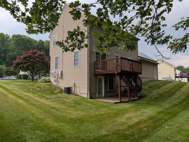 190 Sunnydale Ave, Bristol, CT 06010 - back of house featuring a deck, a lawn, a patio, and central AC unit