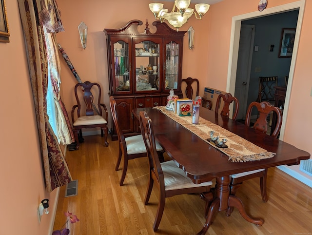 190 Sunnydale Ave, Bristol, CT 06010 - dining room featuring light wood-type flooring and a chandelier