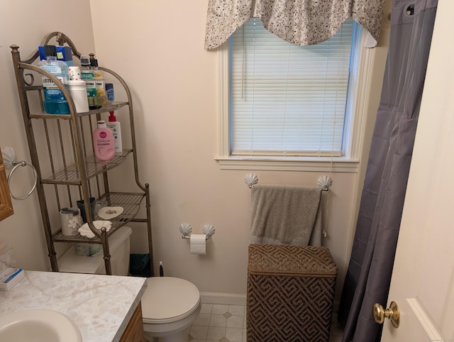 190 Sunnydale Ave, Bristol, CT 06010 - full bath featuring vanity, baseboards, toilet, tile patterned floors, and a shower with curtain