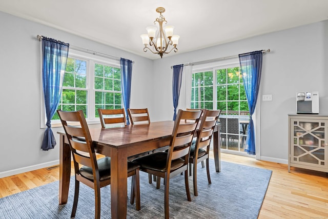 43 Old Young St, East Hampton, CT 06424 - dining space with a chandelier and light wood finished floors