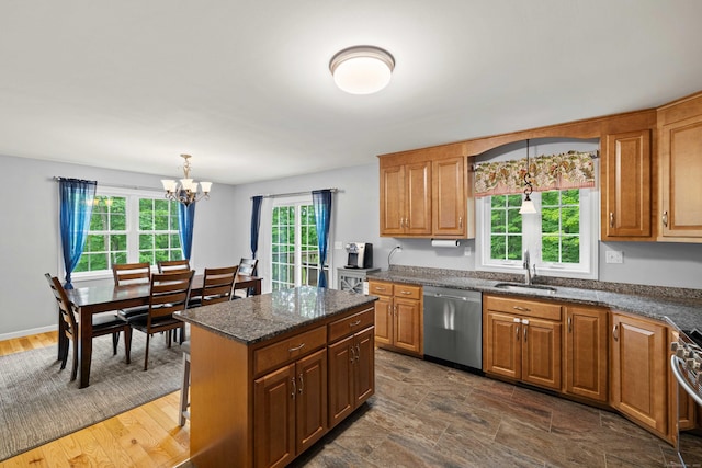 43 Old Young St, East Hampton, CT 06424 - kitchen with stainless steel dishwasher, a chandelier, pendant lighting, and brown cabinets