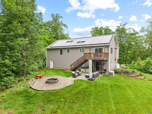 43 Old Young St, East Hampton, CT 06424 - rear view of property with an outdoor fire pit, stairway, a deck, a patio, and a yard