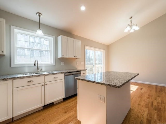 12 S St, Brooklyn, CT 06234 - kitchen featuring stainless steel dishwasher, light wood-style flooring, stone counters, white cabinetry, and lofted ceiling
