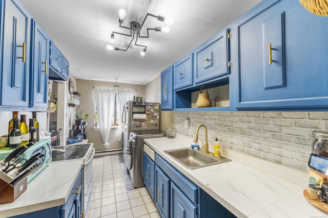 6 Mountain Laurel Ct Unit 6, Cromwell, CT 06416 - kitchen featuring washing machine and dryer, a sink, blue cabinetry, electric range, and light countertops