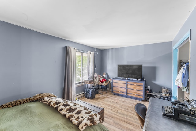 6 Mountain Laurel Ct Unit 6, Cromwell, CT 06416 - bedroom with wood finished floors and a baseboard radiator