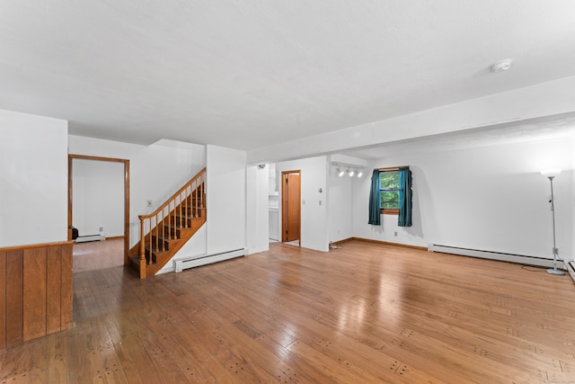 120 Pulaski Hwy, Ansonia, CT 06401 - unfurnished living room with a baseboard heating unit, stairs, and hardwood / wood-style floors