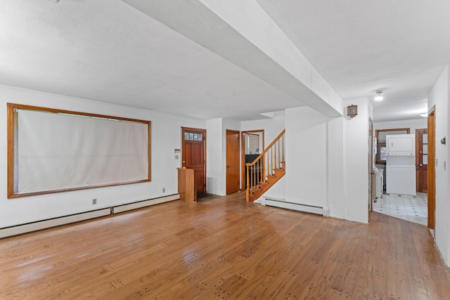 120 Pulaski Hwy, Ansonia, CT 06401 - unfurnished living room with a baseboard radiator, wood-type flooring, and stairs