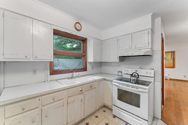 120 Pulaski Hwy, Ansonia, CT 06401 - kitchen featuring electric stove, under cabinet range hood, light countertops, ornamental molding, and a baseboard radiator