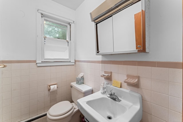 120 Pulaski Hwy, Ansonia, CT 06401 - bathroom featuring a baseboard heating unit, tile walls, and a wainscoted wall