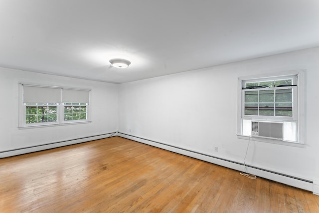 120 Pulaski Hwy, Ansonia, CT 06401 - unfurnished room featuring plenty of natural light, wood finished floors, a baseboard heating unit, and cooling unit