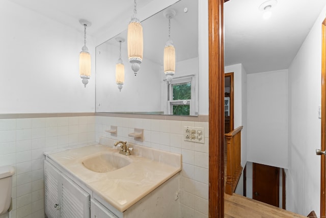 120 Pulaski Hwy, Ansonia, CT 06401 - half bathroom with tile walls, vanity, and a wainscoted wall