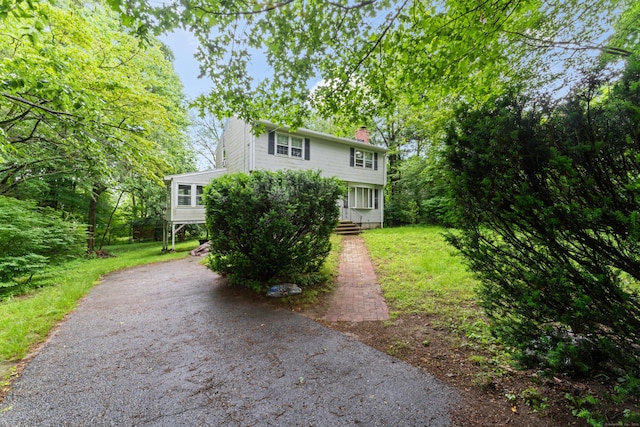 120 Pulaski Hwy, Ansonia, CT 06401 - view of front of home featuring a chimney, asphalt driveway, and a front yard