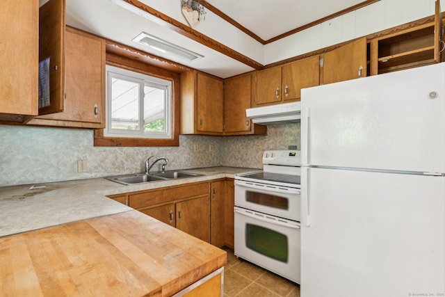 44 Nod Rd, Clinton, CT 06413 - kitchen with white appliances, under cabinet range hood, a sink, brown cabinets, and crown molding