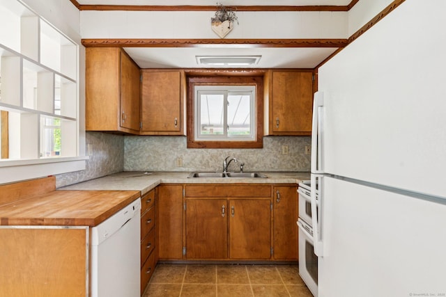 44 Nod Rd, Clinton, CT 06413 - kitchen with a sink, white appliances, brown cabinetry, light countertops, and backsplash