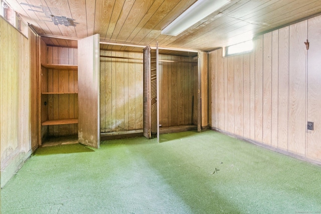 44 Nod Rd, Clinton, CT 06413 - below grade area featuring wood ceiling, wood walls, and carpet