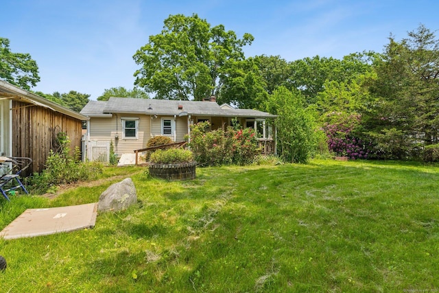 44 Nod Rd, Clinton, CT 06413 - rear view of property featuring a lawn and a chimney