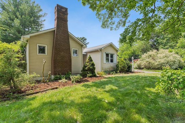 44 Nod Rd, Clinton, CT 06413 - view of side of home with a chimney and a yard