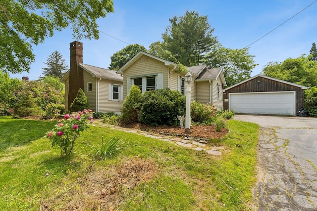 44 Nod Rd, Clinton, CT 06413 - view of front of property with a garage, an outbuilding, and a front lawn