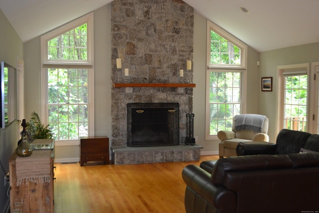 52 Grumman Ave, Wilton, CT 06897 - living room with wood finished floors, a stone fireplace, and high vaulted ceiling