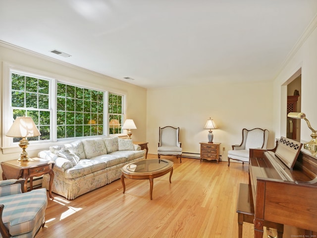 52 Grumman Ave, Wilton, CT 06897 - living area with ornamental molding, a baseboard radiator, and light wood finished floors