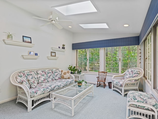 52 Grumman Ave, Wilton, CT 06897 - carpeted living area with vaulted ceiling, a skylight, ceiling fan, and recessed lighting