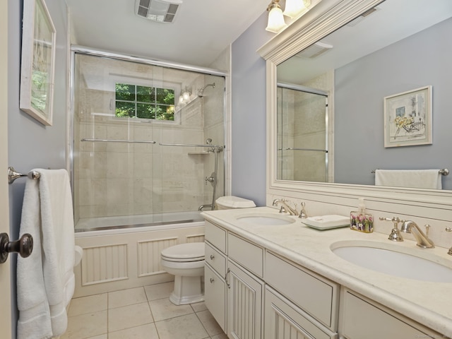 52 Grumman Ave, Wilton, CT 06897 - full bathroom with tile patterned floors, shower / bath combination with glass door, and double vanity