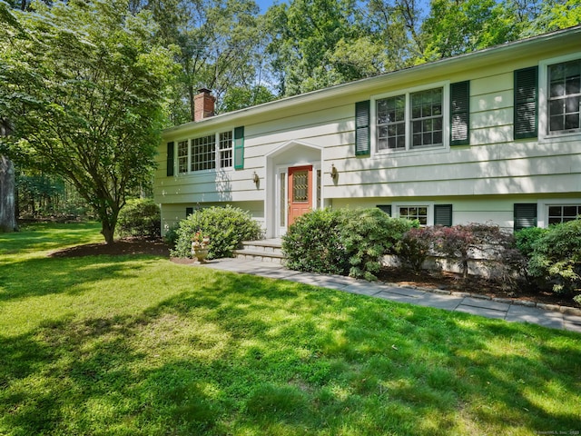 52 Grumman Ave, Wilton, CT 06897 - raised ranch with a chimney and a front lawn
