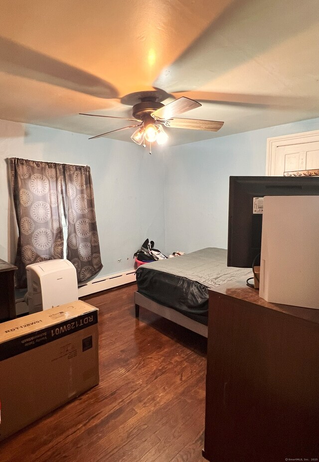 238 E Main St, Torrington, CT 06790 - bedroom featuring dark wood-style floors, baseboard heating, and ceiling fan