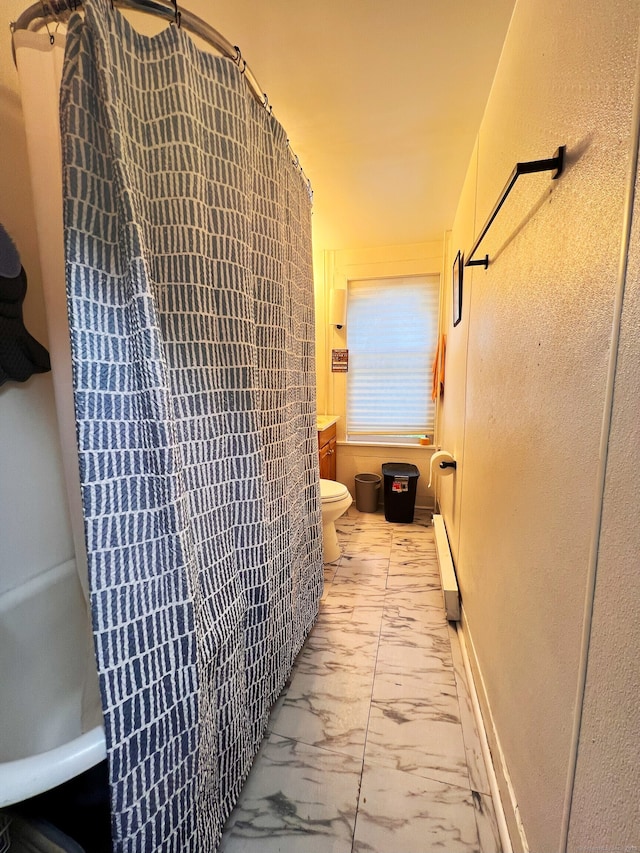 238 E Main St, Torrington, CT 06790 - bathroom with marble look tile flooring and a baseboard heating unit