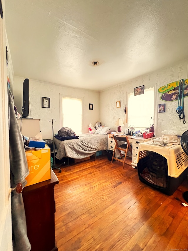 238 E Main St, Torrington, CT 06790 - bedroom with hardwood / wood-style flooring, a textured wall, and a textured ceiling
