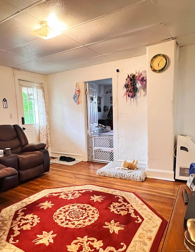 238 E Main St, Torrington, CT 06790 - living area with wood finished floors and heating unit
