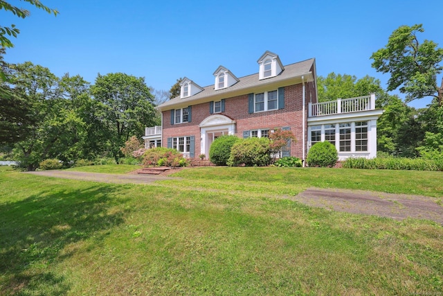 2200 Ridge Rd, North Haven, CT 06473 - colonial inspired home with brick siding, a front lawn, and a balcony