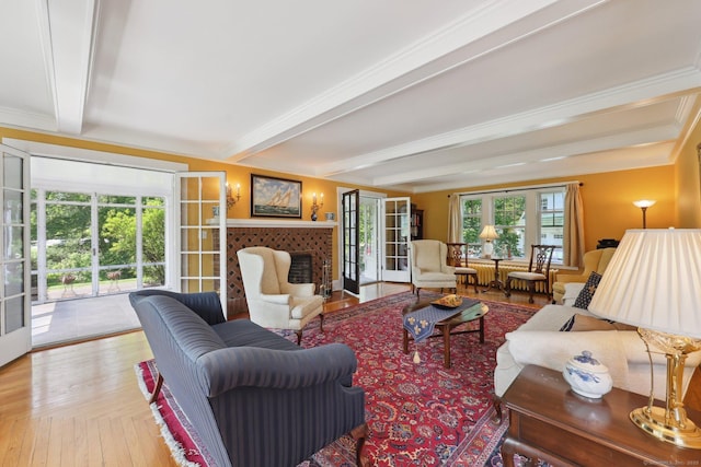 2200 Ridge Rd, North Haven, CT 06473 - living room featuring beam ceiling, wood finished floors, french doors, and a tile fireplace