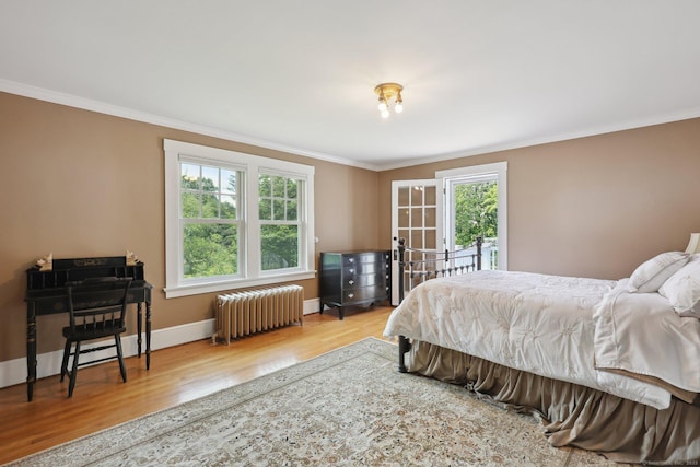 2200 Ridge Rd, North Haven, CT 06473 - bedroom featuring radiator heating unit, wood finished floors, and crown molding
