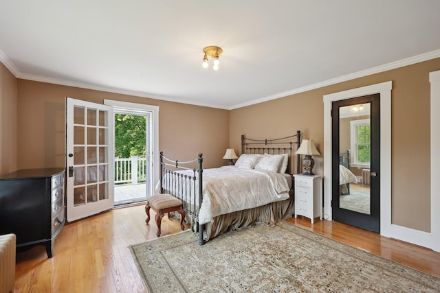 2200 Ridge Rd, North Haven, CT 06473 - bedroom featuring multiple windows, access to outside, light wood-style flooring, and crown molding