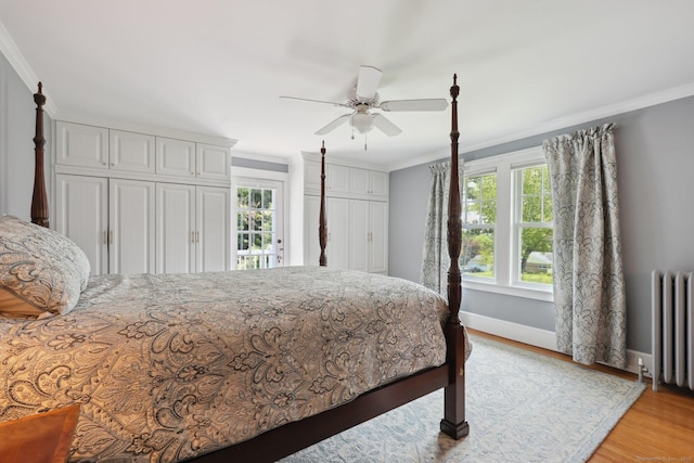 2200 Ridge Rd, North Haven, CT 06473 - bedroom with radiator, ornamental molding, light wood-type flooring, access to outside, and a ceiling fan