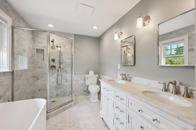 2200 Ridge Rd, North Haven, CT 06473 - full bath featuring a freestanding bath, a stall shower, double vanity, a wainscoted wall, and tile walls