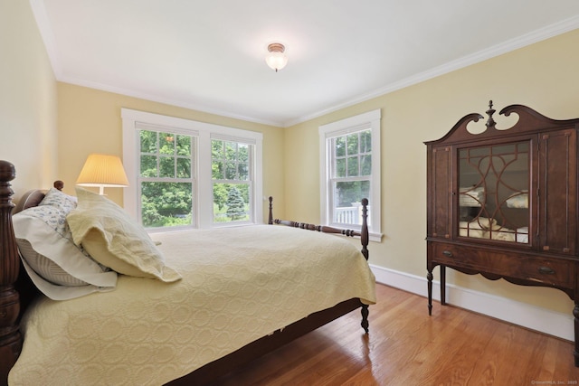 2200 Ridge Rd, North Haven, CT 06473 - bedroom with light wood-style flooring and ornamental molding