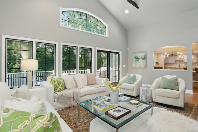 158 Linden Tree Rd, Wilton, CT 06897 - living area with high vaulted ceiling, healthy amount of natural light, wood finished floors, arched walkways, and recessed lighting