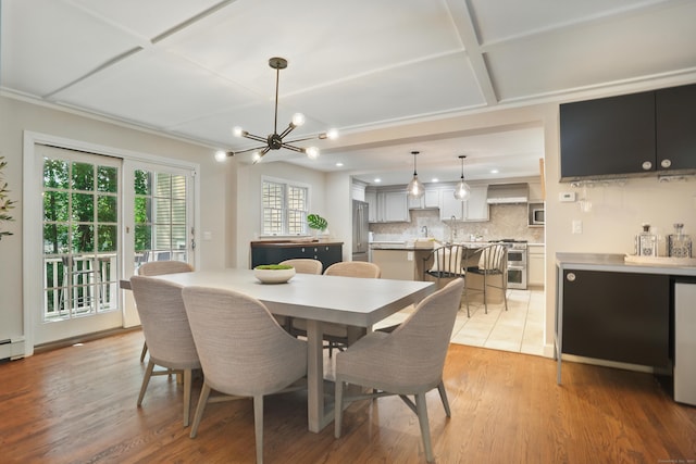 158 Linden Tree Rd, Wilton, CT 06897 - dining area with coffered ceiling, a chandelier, light wood-style floors, recessed lighting, and crown molding
