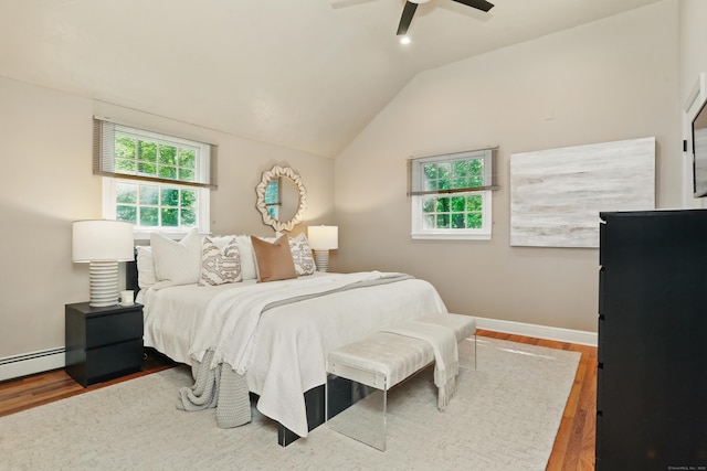 158 Linden Tree Rd, Wilton, CT 06897 - bedroom with multiple windows, wood finished floors, a ceiling fan, vaulted ceiling, and baseboards