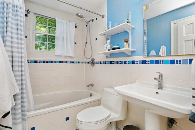 158 Linden Tree Rd, Wilton, CT 06897 - bathroom with tiled shower / bath combo, tile walls, and wainscoting