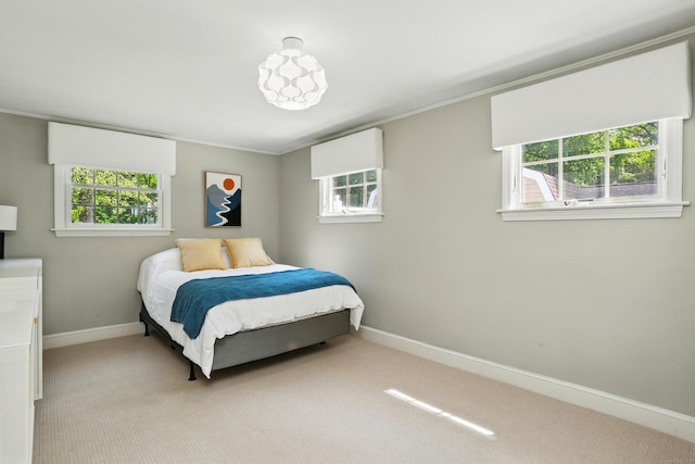 158 Linden Tree Rd, Wilton, CT 06897 - bedroom featuring light colored carpet, baseboards, multiple windows, and crown molding