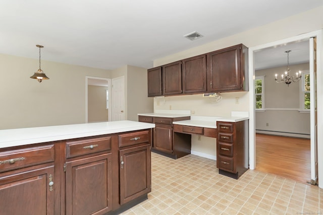 130 Sturbridge Ln, Fairfield, CT 06890 - kitchen with a baseboard heating unit, light countertops, a chandelier, and decorative light fixtures