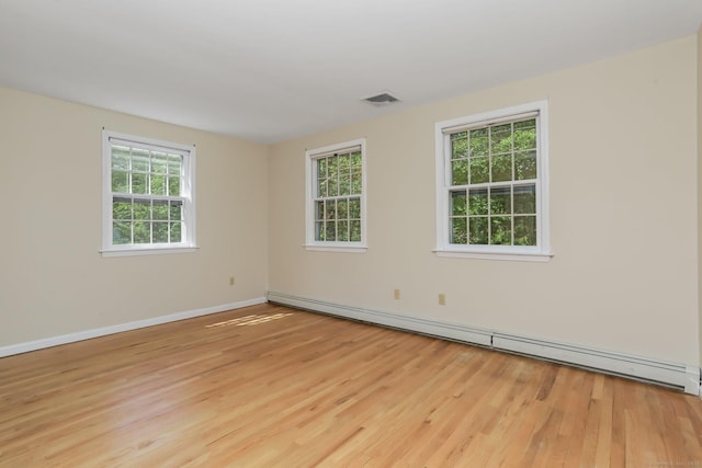 130 Sturbridge Ln, Fairfield, CT 06890 - spare room featuring wood finished floors and a baseboard heating unit