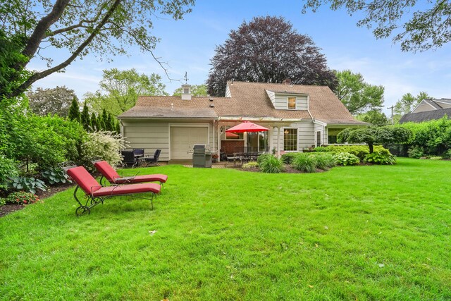 86 Lorma Ave, Trumbull, CT 06611 - rear view of house with a garage, a yard, a patio area, and a chimney