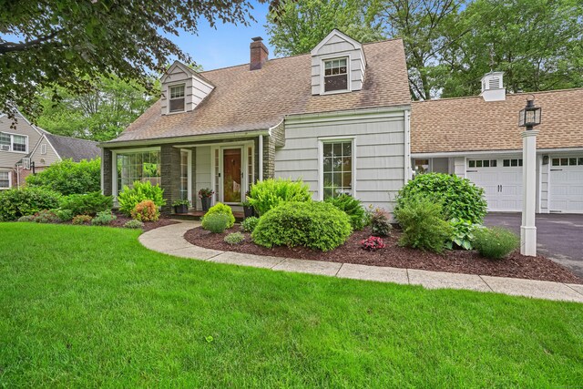 86 Lorma Ave, Trumbull, CT 06611 - cape cod-style house with a chimney, a front lawn, roof with shingles, a garage, and driveway